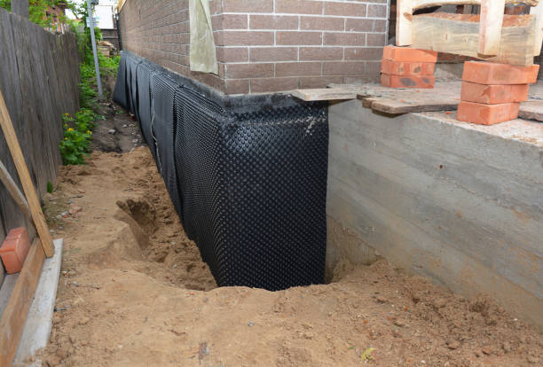 Happy homeowners after waterproofing job in Deatsville